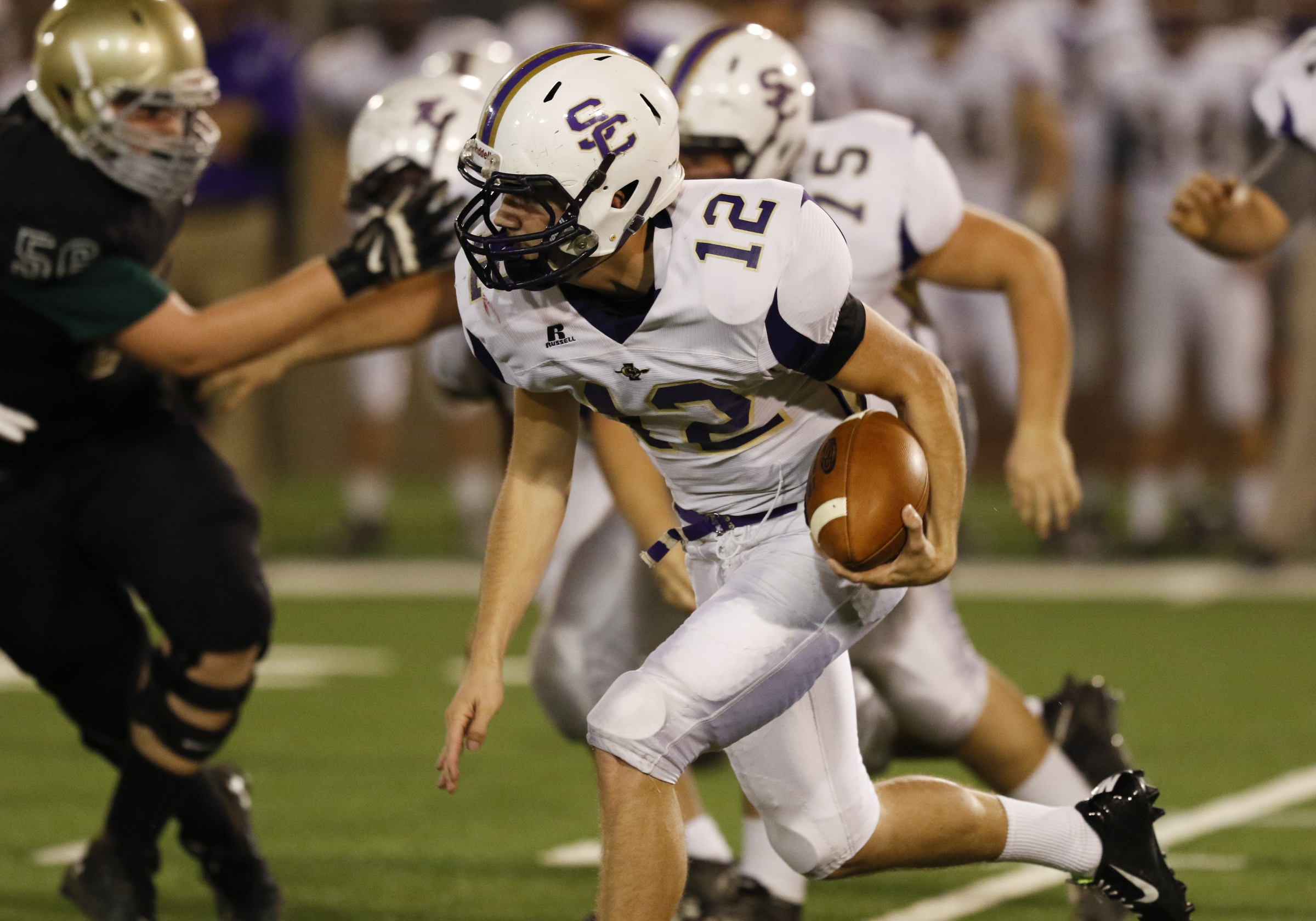 Staff Photo by Dan Henry / The Chattanooga Times Free Press- 11/6/15. Sequatchie County's Houston Mainord (12) runs the ball past Notre Dame High School defenders during the first half of play at Finley Stadium in downtown Chattanooga on Friday.