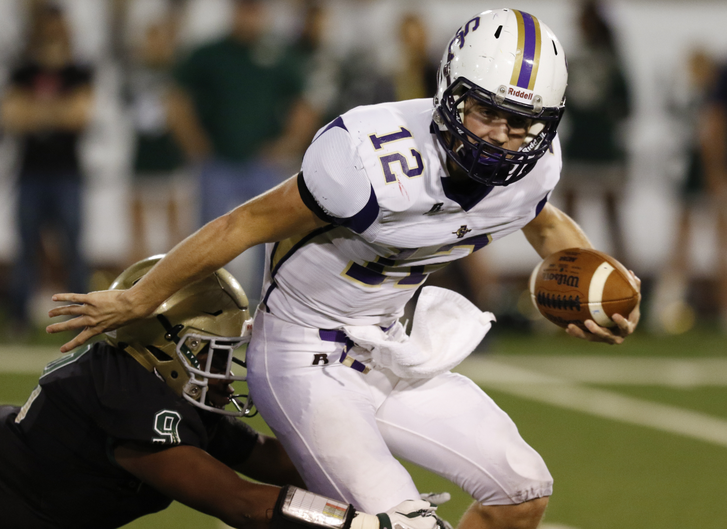 Staff Photo by Dan Henry / The Chattanooga Times Free Press- 11/6/15. Sequatchie County's Houston Mainord (12) is sacked by Notre Dame High School's James Williams (9) during the first half of play at Finley Stadium in downtown Chattanooga on Friday.