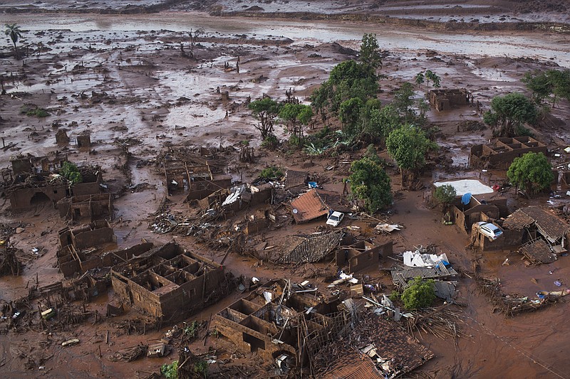 
              Aerial view of the debris after a dam burst on Thursday, at the small town of Bento Rodrigues in Minas Gerais state, Brazil, Friday, Nov. 6, 2015.  Brazilian rescuers searched feverishly Friday for possible survivors after two dams burst at an iron ore mine in a southeastern mountainous area.  (AP Photo/Felipe Dana)
            