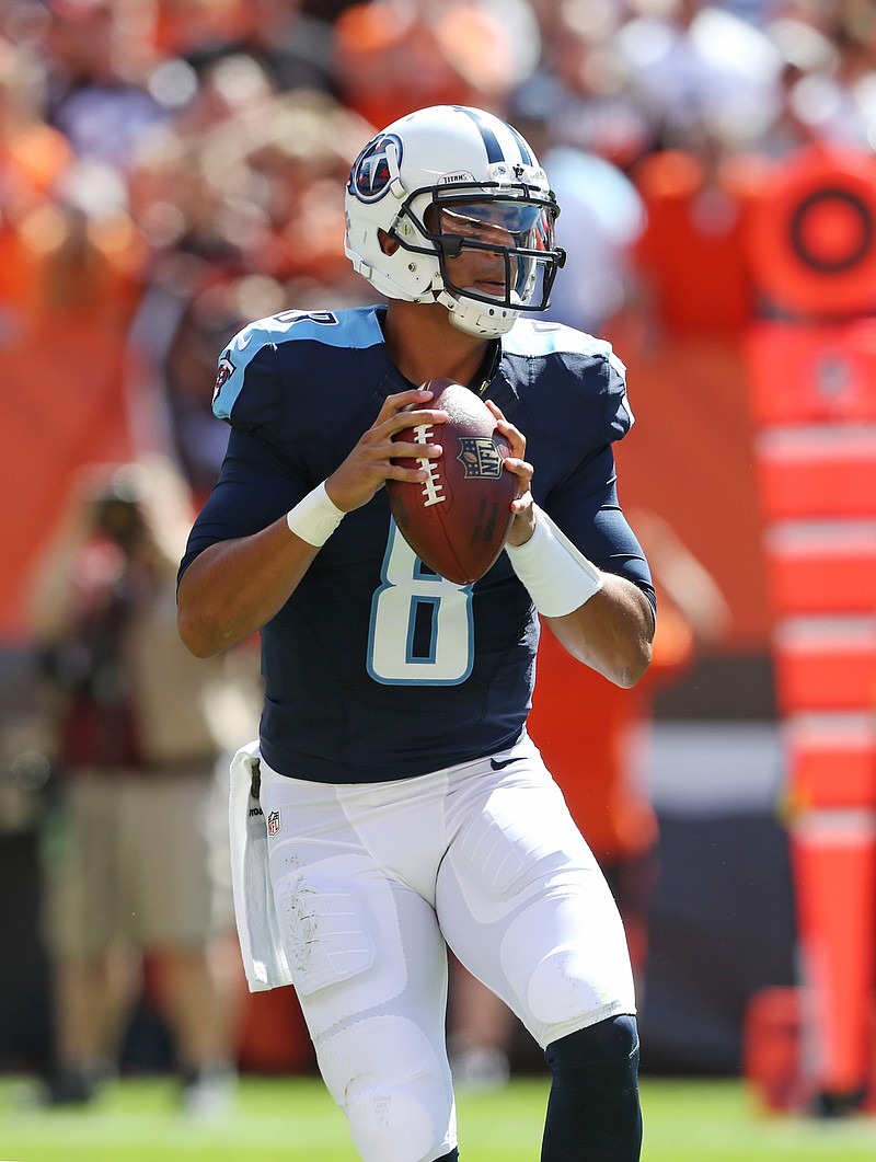 
              FILE - In this Sept. 20, 2015, file photo, Tennessee Titans quarterback Marcus Mariota (8) looks to pass against the Cleveland Browns during an NFL football game, in Cleveland. Mariota appears set to return after missing two weeks with a sprained MCL in his left knee. The Titans quarterback could be without his top receiver in Kendall Wright on Sunday, Nov. 9 against New Orleans.  (AP Photo/Ron Schwane, File)
            