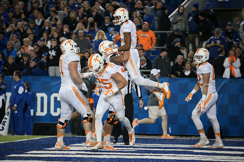 Tennessee receiver Josh Malone celebrates with teammates after catching a 75-yard touchdown pass at Kentucky on Oct. 31, 2015. (Photo By Craig Bisacre/Tennessee Athletics)