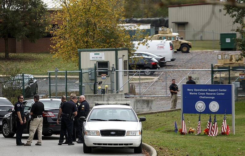 Staff photo by Doug Strickland / Police stand in front of the Naval Operational Support Center and Marine Corps Reserve Center on Amnicola Highway after reports of a shots fired call nearby on Wednesday, Nov. 4 in Chattanooga. The center is the site of the July, 16, shootings which took the lives of five armed service members. According to police, there was no threat.
