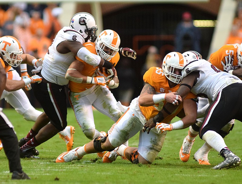 Tennessee's Jalen Hurd (1) is stopped by South Carolina's Phillip Dukes (52), while Volunteer lineman Coleman Thomas (55) blocks.  The South Carolina Gamecocks visited the Tennessee Volunteers in SEC football action November 7, 2015.