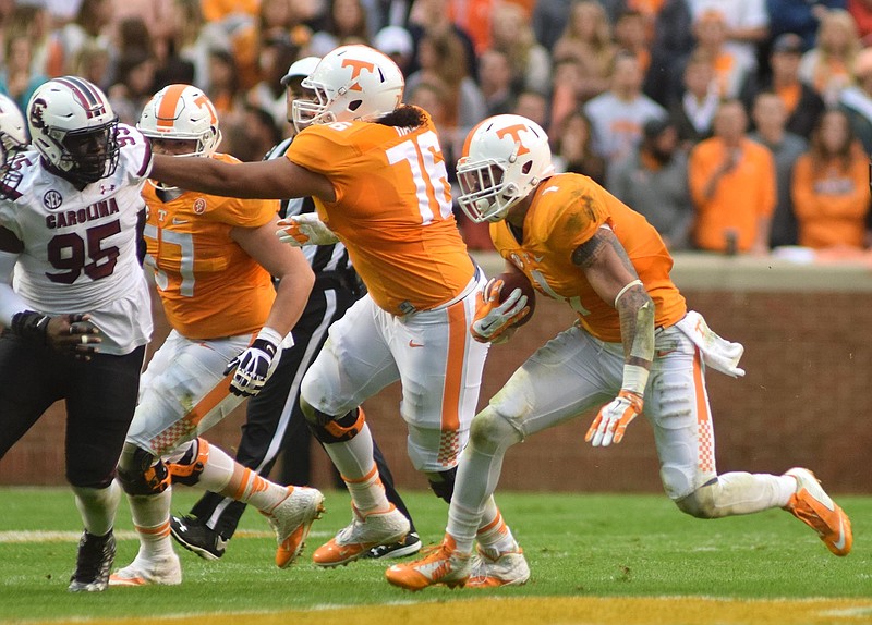 Tennessee's Jalen Hurd (1) gains yards behind the blocking of Chance Hall (76).  The South Carolina Gamecocks visited the Tennessee Volunteers in SEC football action November 7, 2015.