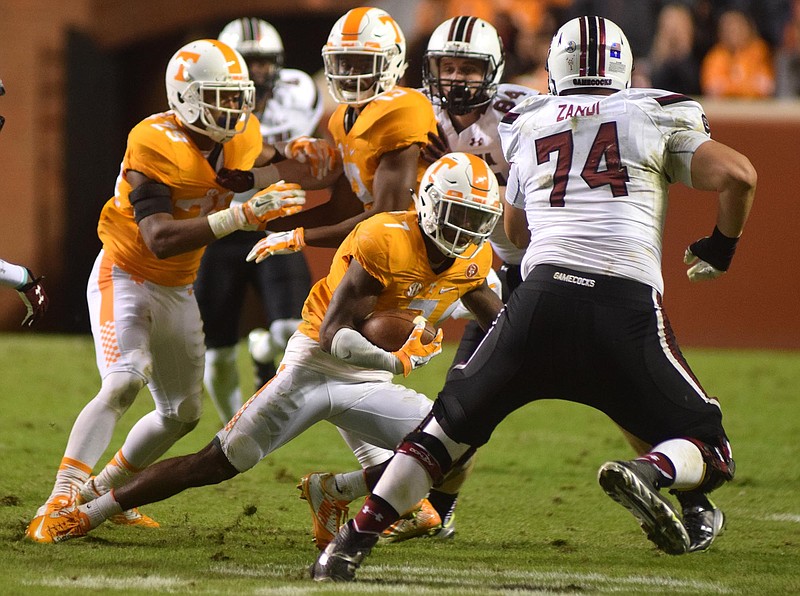 Tennessee's Cameron Sutton (7) cuts to avoid South Carolina's Mason Zandi (74) on a punt return.  The South Carolina Gamecocks visited the Tennessee Volunteers in SEC football action November 7, 2015.