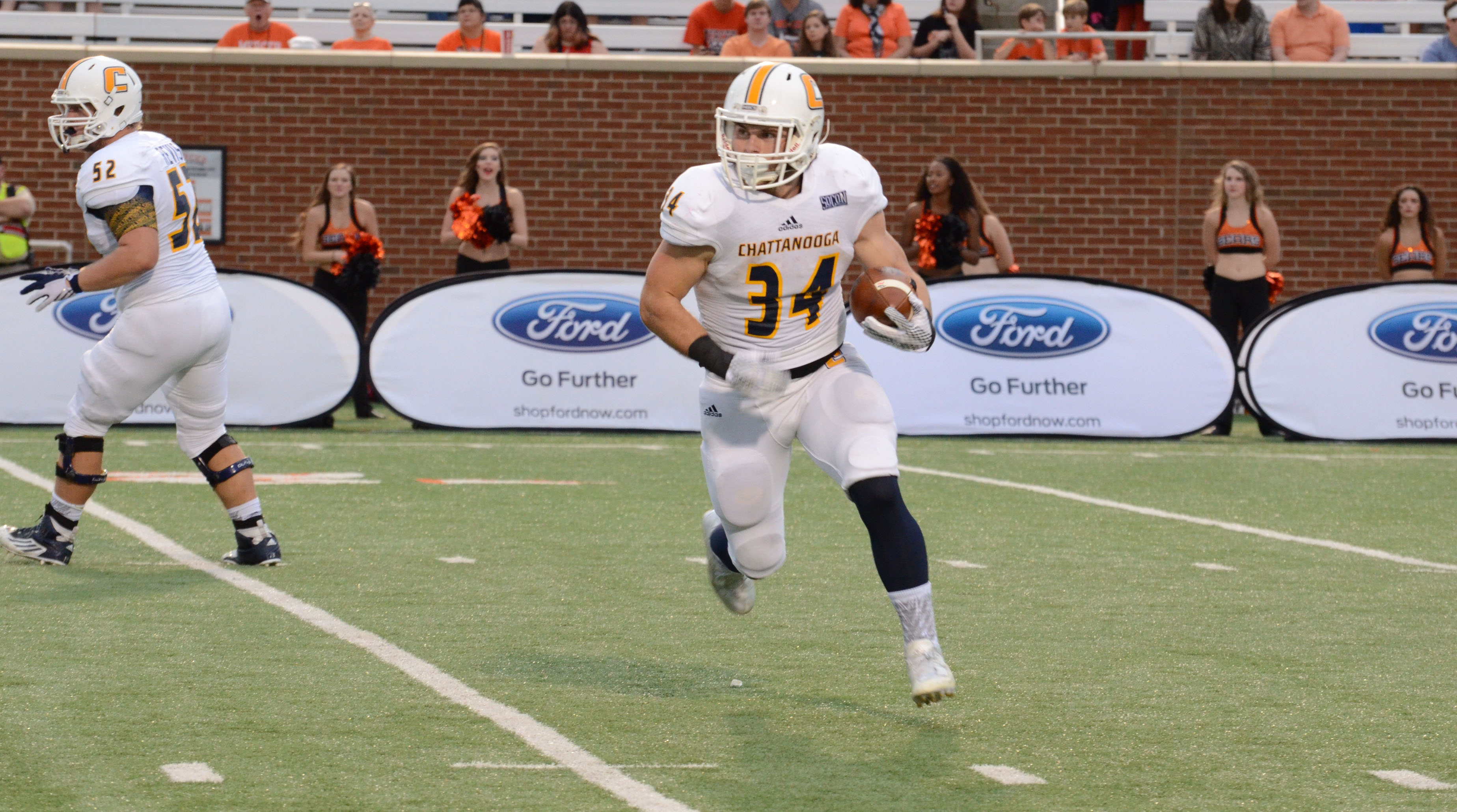 UTC's Derrick Craine runs against Mercer