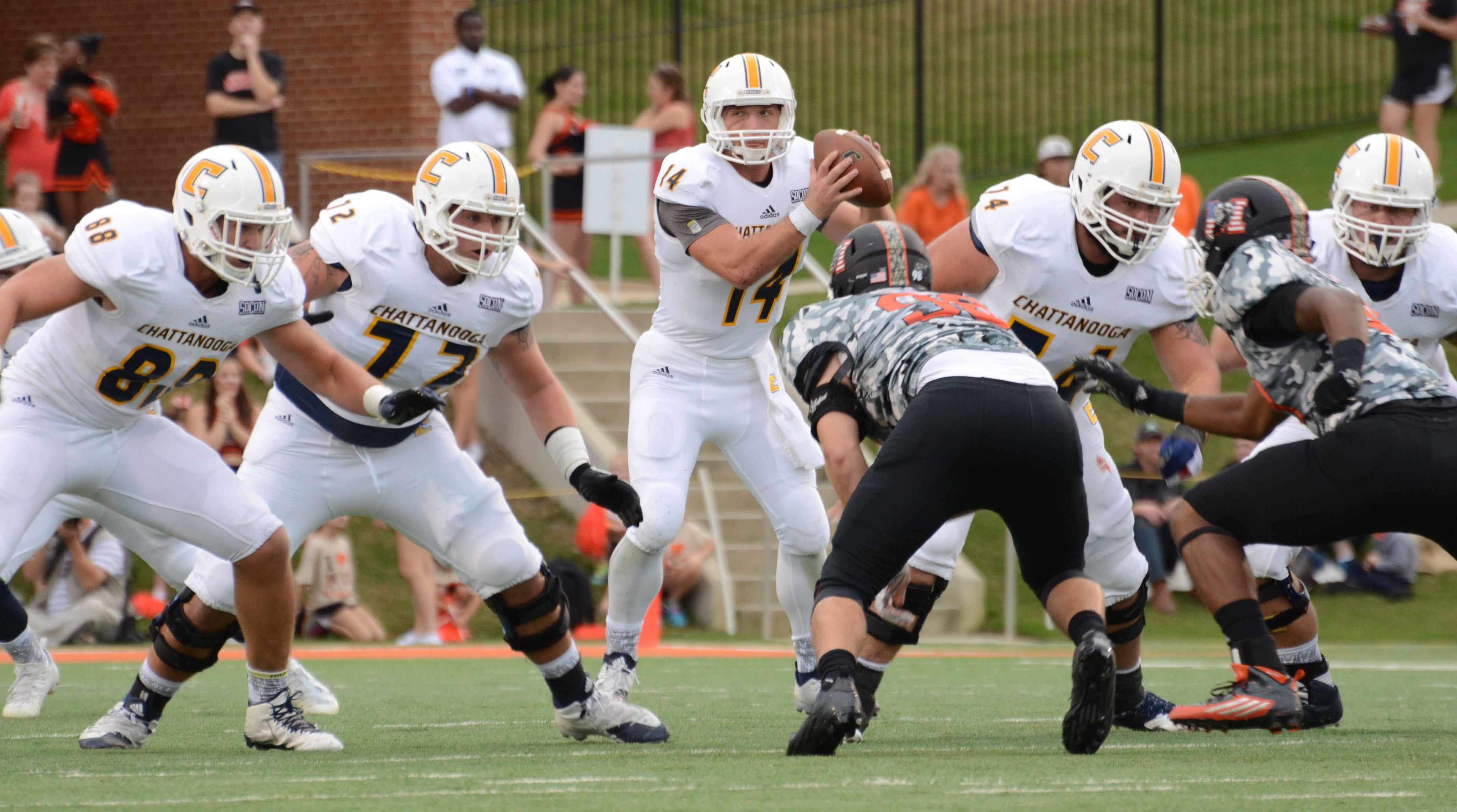 UTC's Jacob Huesman and offensive line against Mercer