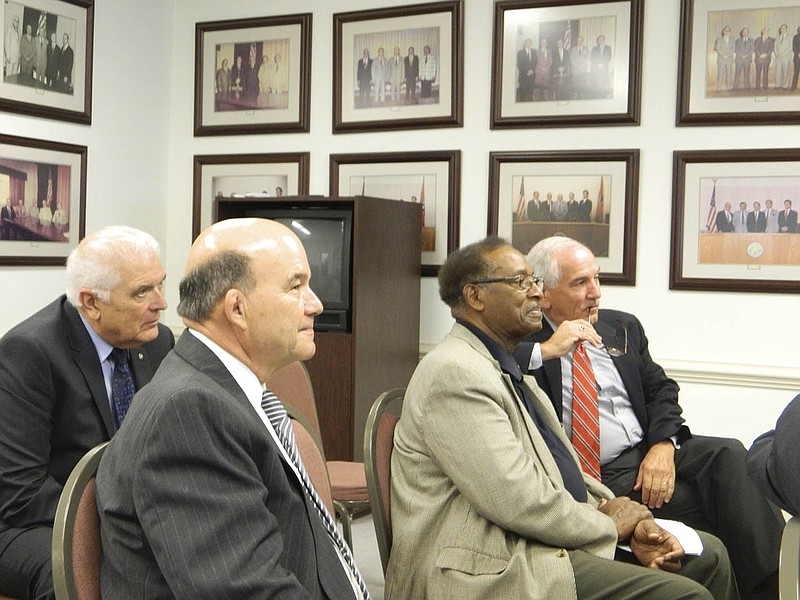 With the reconvening of Cleveland's city charter committee, Bank of Cleveland CEO Scott Taylor, right, has been appointed as the group's chairman. From left, consultant Larry Wallace, committee member Robert Burris and City Councilman Avery Johnson listen to discussions concerning the committee's task to review the city's charter, which dates back to 1993.
