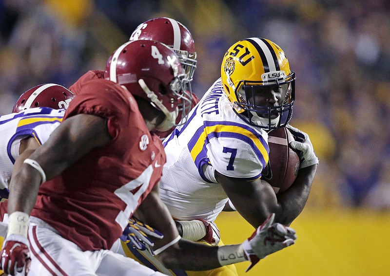 
              FILE - In this Nov. 8, 2014, file photo, LSU running back Leonard Fournette (7) carries in the first half of an NCAA college football game against Alabama in Baton Rouge, La. One of the best fronts in the country takes on the nation's leading rusher and Heisman Trophy candidate when Alabama and LSU meet Saturday, Nov. 7, 2015. (AP Photo/Gerald Herbert, File)
            