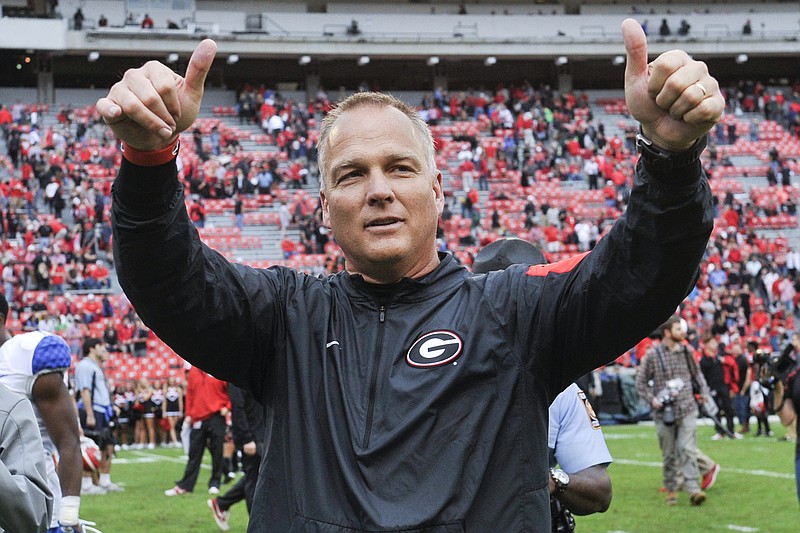 Georgia head coach Mark Richt gives a thumbs up to the crowd as he walks off the field after an NCAA college football game against Kentucky, Saturday, Nov. 7, 2015, in Athens, Ga. Georgia won 27-3. (AP Photo/John Amis)