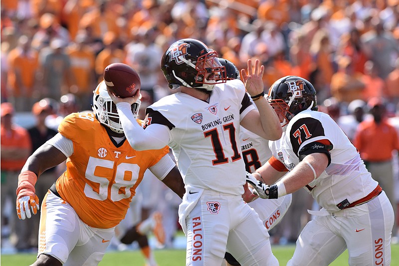 Tennessee's Owen Williams (58) closes in on Bowling Green's quaterback Matt Johnson (11).  The Tennessee Volunteers hosted the Bowling Green Falcons at Nissan Stadium in Nashville September 5, 2015.