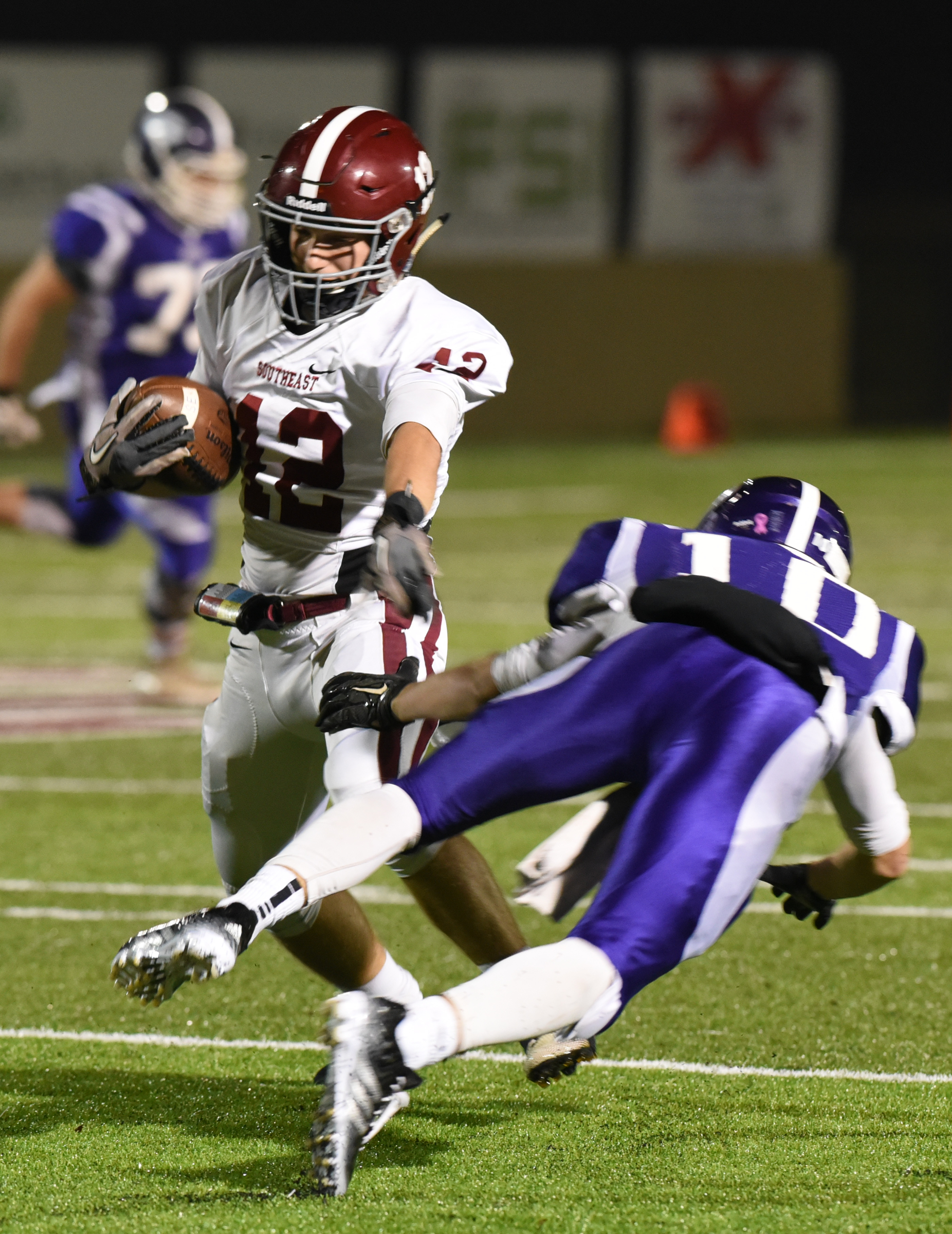 Southeast Whitfield's Colton Faith evades Gilmer County's Kell Kiker in the first of two playoff games at Monday, November 9, 2015 at Christian Heritage School. Gilmer County won and advanced to face Ridgeland.