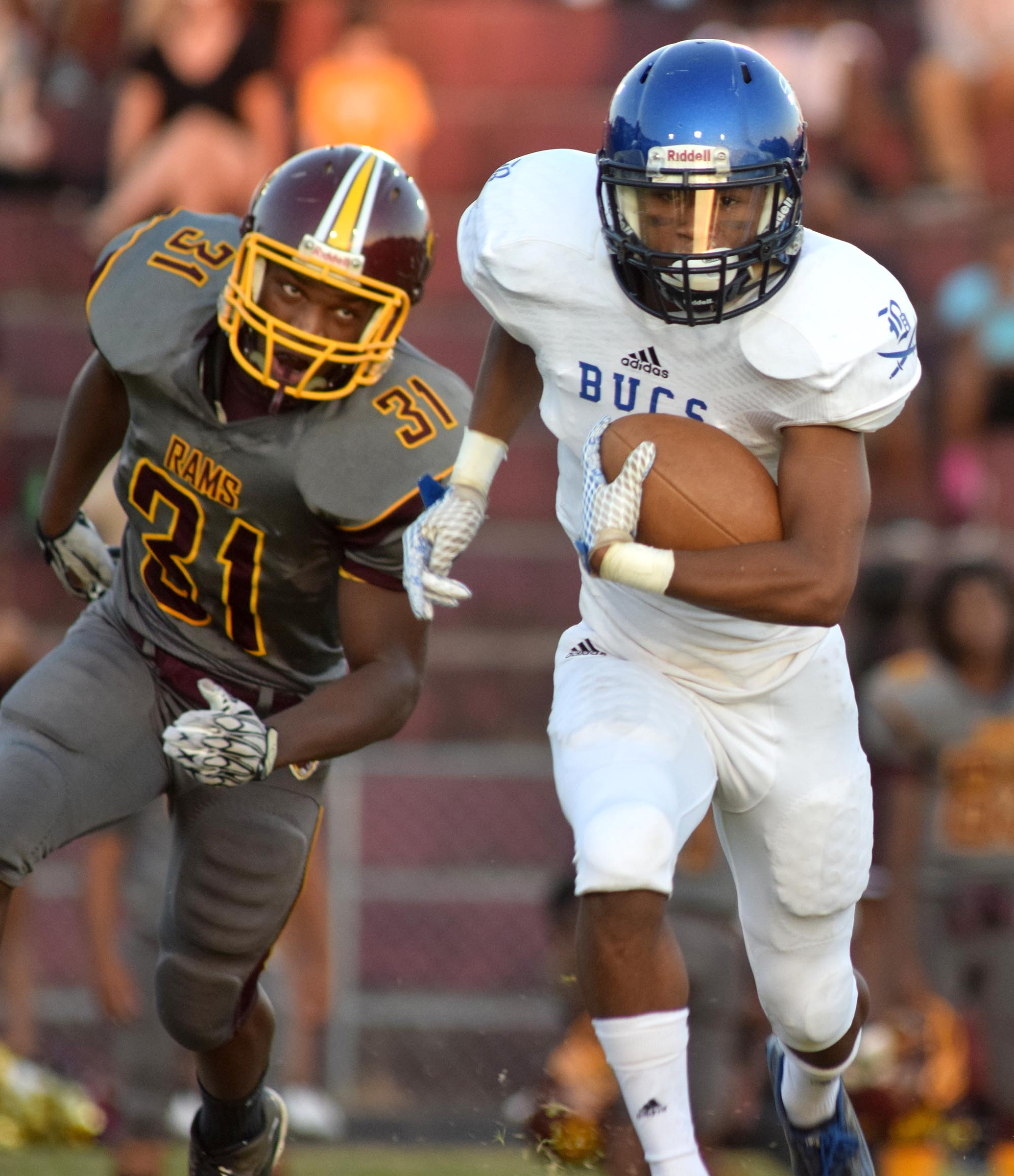 Boyd-Buchanan's Jeremy Borders (6) gets by Tyner's Jordan Hubbard (31) as he runs a punt back for the Buccaneer's first touchdown. The Boyd-Buchanan Buccaneers visited the Tyner Rams in TSSAA football action Saturday September 18, 2015.