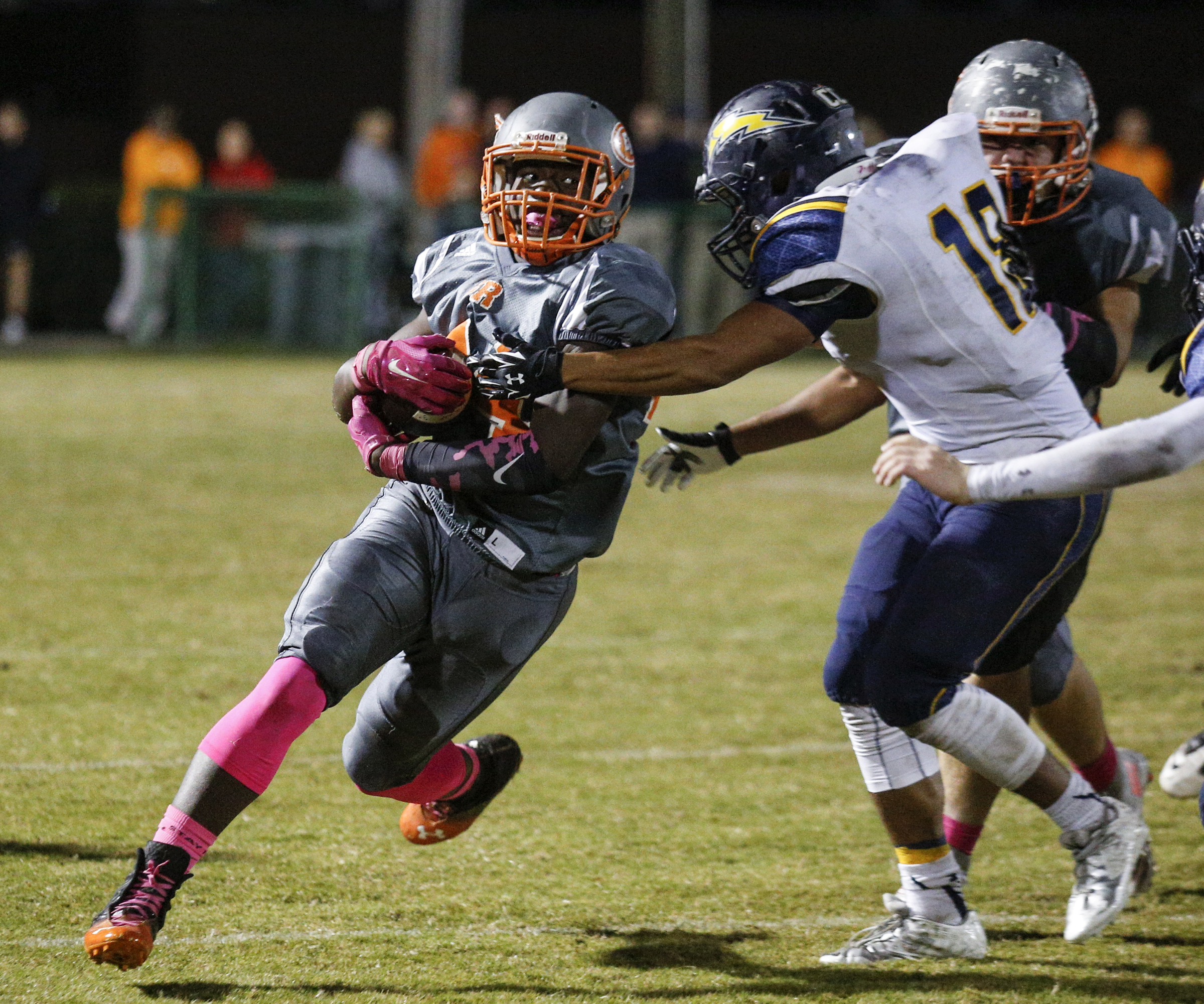 East Ridge running back Lorenzo Stewart, left, breaks around CCS defender Ian Gaines during their prep football game at East Ridge High School on Friday, Oct. 30, 2015, in East Ridge, Tenn.
