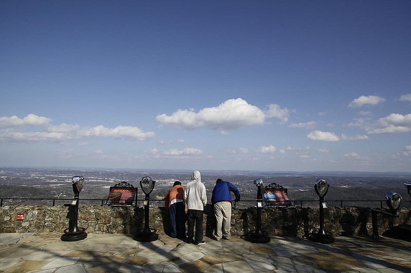 A group of friends enjoy the view from Rock City on Lookout Mountain. Chattanooga has made measurable strides in the improvement of the area's air quality.