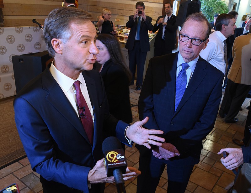 Inside the Tennessee Welcome Center on Interstate 75, Governor Bill Haslam speaks about possible solutions for the Interstate 75/I-24 junction project as one of the transportation needs for our area.
TDOT Commissioner John Schroer, right, listens.