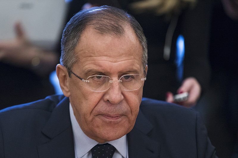 
              FILE - In this Thursday, Nov. 5, 2015 file photo, Russian Foreign Minister Sergey Lavrov attends a meeting with U.N. Under-Secretary-General and Emergency Relief Coordinator Stephen O'Brien in Moscow, Russia. Russia's foreign minister said Monday Nov. 9, 2015, the next round of Syria talks expected to be held this weekend must not focus squarely on demands for Syrian President Bashar Assad's resignation, which he called a "simplistic approach." The talks should focus instead on reaching consensus on who should represent the Syrian opposition and who should be considered extremists. (AP Photo/Pavel Golovkin, File)
            