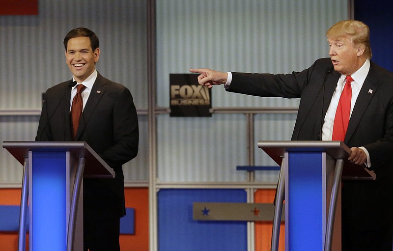 Marco Rubio laughs as Donald Trump makes a point during Republican presidential debate at Milwaukee Theatre on Tuesday, Nov. 10, 2015, in Milwaukee.