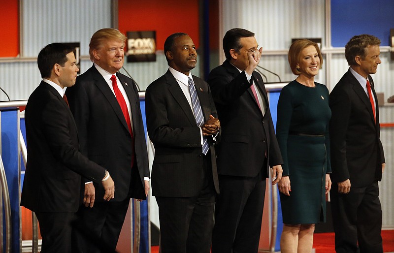 Republican presidential candidates John Kasich, Jeb Bush, Marco Rubio, Donald Trump, Ben Carson, Ted Cruz, Carly Fiorina and Rand Paul take the stage during Republican presidential debate at Milwaukee Theatre on Tuesday, Nov. 10, 2015, in Milwaukee.