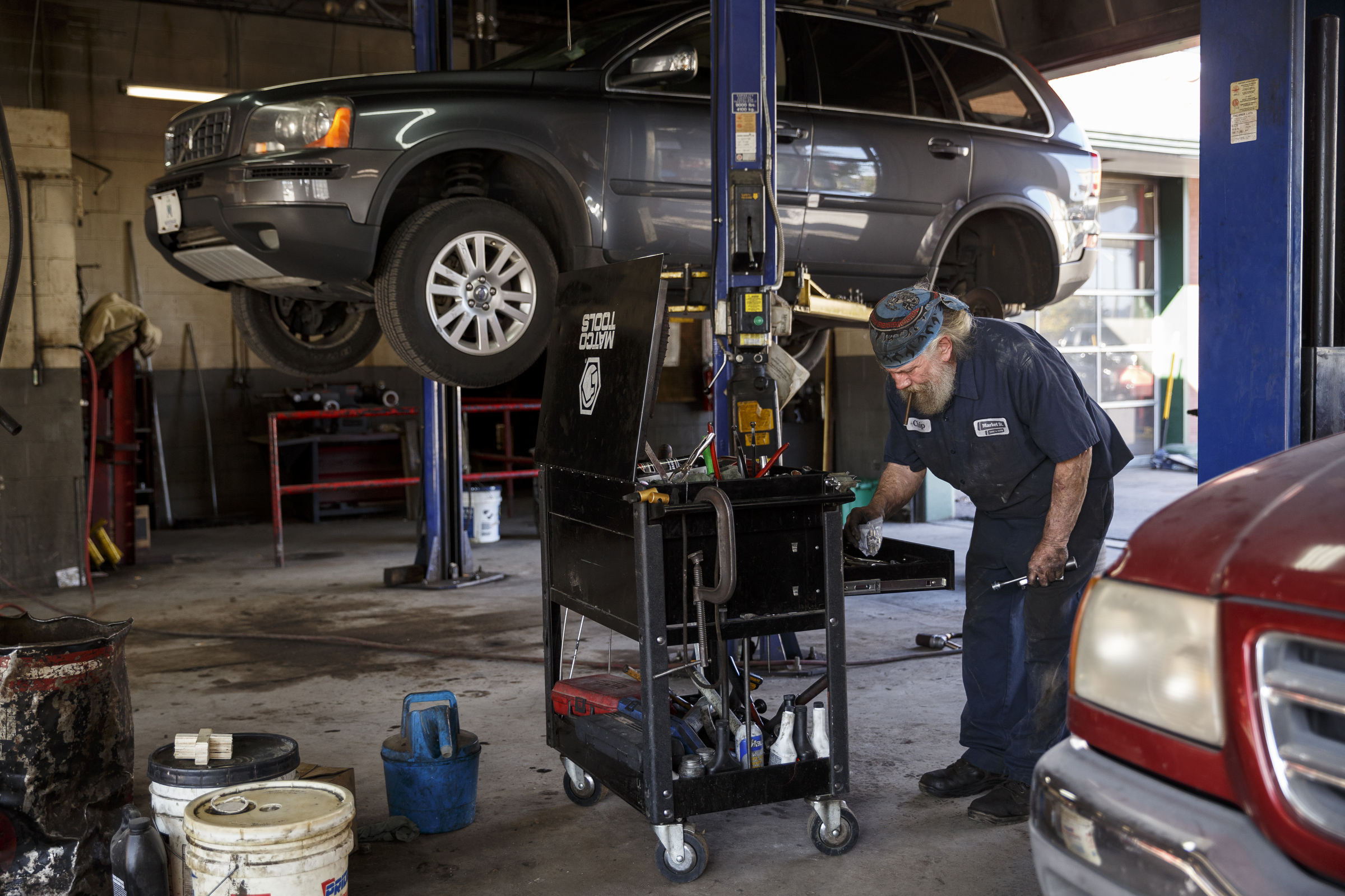 Mechanic Chip Paris looks through a tool chest while working on a vehicle at Market Street Tire & Auto on Wednesday, Nov. 11, 2015, in Chattanooga, Tenn. The business is preparing to close for 6-8 weeks before returning as a corporate Firestone Tire location.