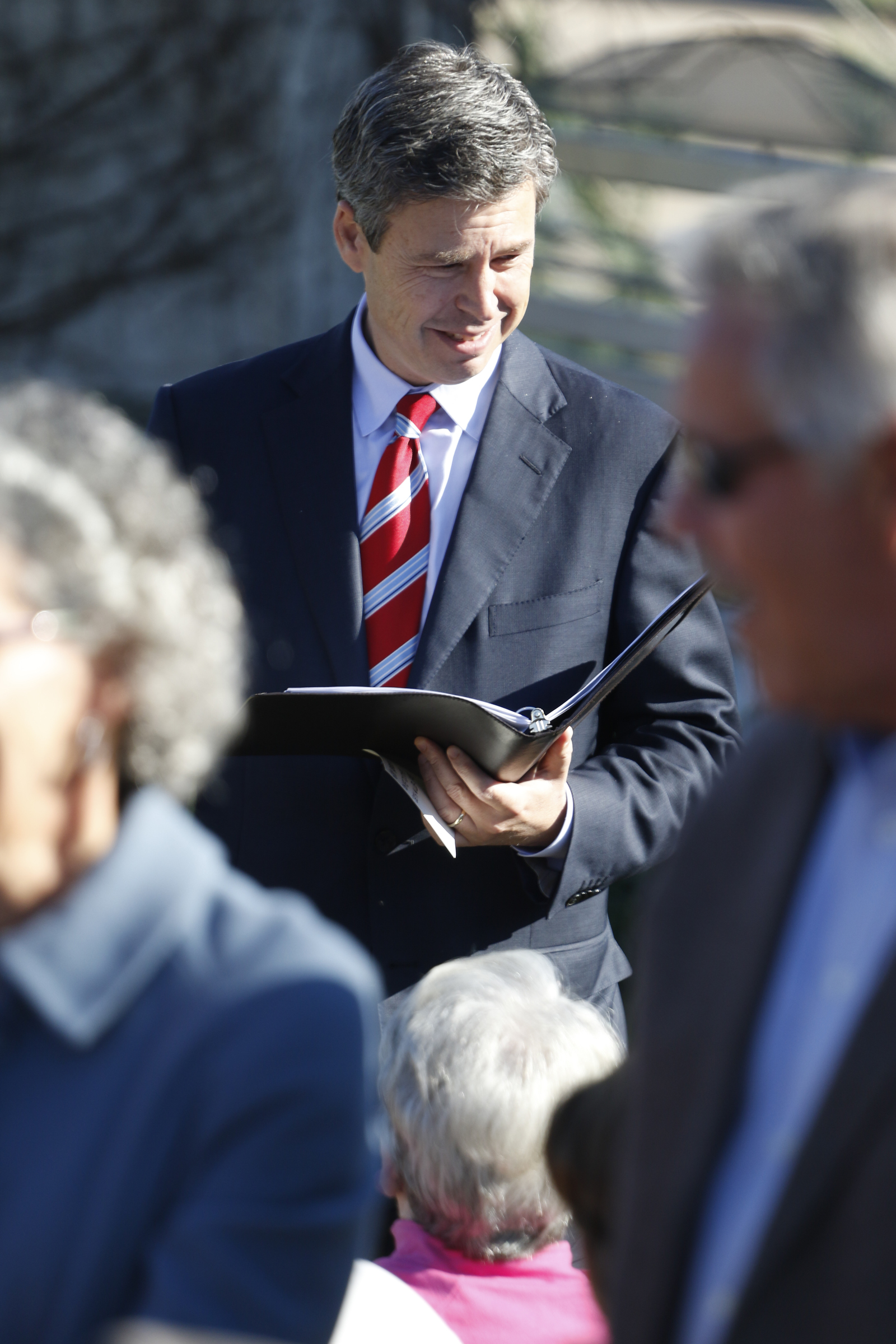 Staff Photo by Dan Henry / The Chattanooga Times Free Press- 11/11/15. Chattanooga Mayor Andy Berke speaks to patriots and officials during a flag raising ceremony in the Bluff View River Gallery Sculpture Garden in honor of Veterans Day on Wednesday, November 11, 2015. Five flags will be permanently flown on Veteran's Bridge in honor of the military personnel lost earlier this year.