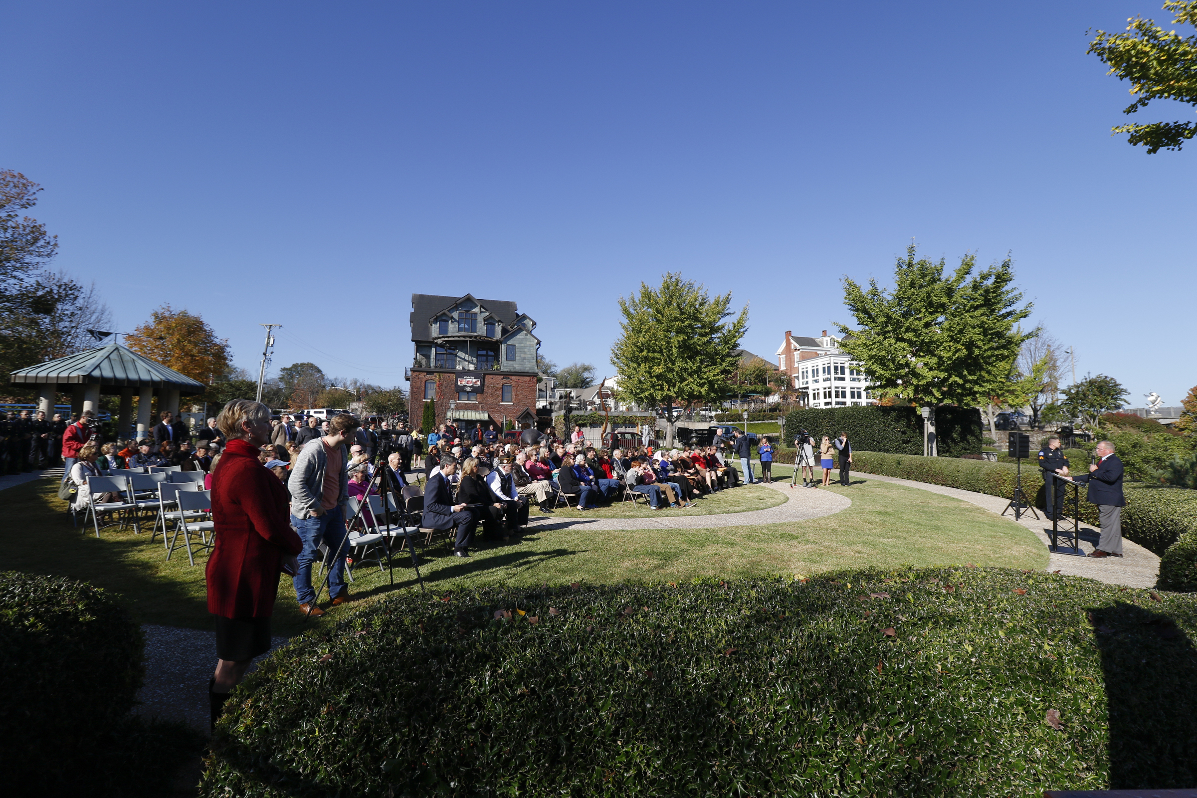 Staff Photo by Dan Henry / The Chattanooga Times Free Press- 11/11/15. Chattanooga Mayor Andy Berke speaks to patriots and officials during a flag raising ceremony in the Bluff View River Gallery Sculpture Garden in honor of Veterans Day on Wednesday, November 11, 2015. Five flags will be permanently flown on Veteran's Bridge in honor of the military personnel lost earlier this year.