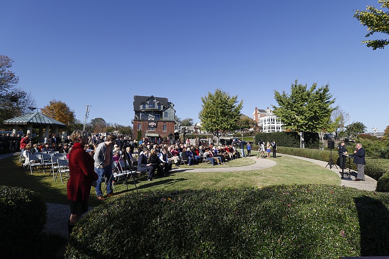 Staff Photo by Dan Henry / The Chattanooga Times Free Press- 11/11/15. Chattanooga Mayor Andy Berke speaks to patriots and officials during a flag raising ceremony in the Bluff View River Gallery Sculpture Garden in honor of Veterans Day on Wednesday, November 11, 2015. Five flags will be permanently flown on Veteran's Bridge in honor of the military personnel lost earlier this year. 