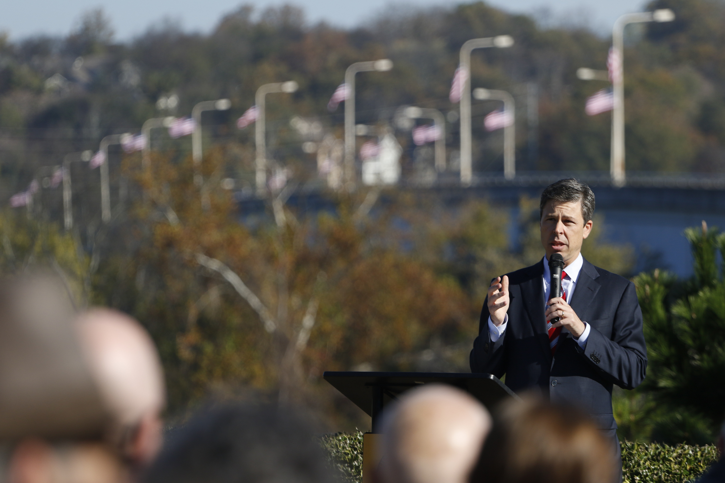 Staff Photo by Dan Henry / The Chattanooga Times Free Press- 11/11/15. Chattanooga Mayor Andy Berke speaks to patriots and officials during a flag raising ceremony in the Bluff View River Gallery Sculpture Garden in honor of Veterans Day on Wednesday, November 11, 2015. Five flags will be permanently flown on Veteran's Bridge in honor of the military personnel lost earlier this year.