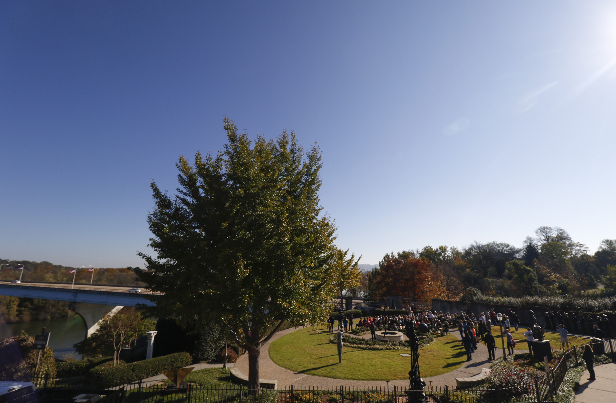 Staff Photo by Dan Henry / The Chattanooga Times Free Press- 11/11/15. Chattanooga Mayor Andy Berke speaks to patriots and officials during a flag raising ceremony in the Bluff View River Gallery Sculpture Garden in honor of Veterans Day on Wednesday, November 11, 2015. Five flags will be permanently flown on Veteran's Bridge in honor of the military personnel lost earlier this year.