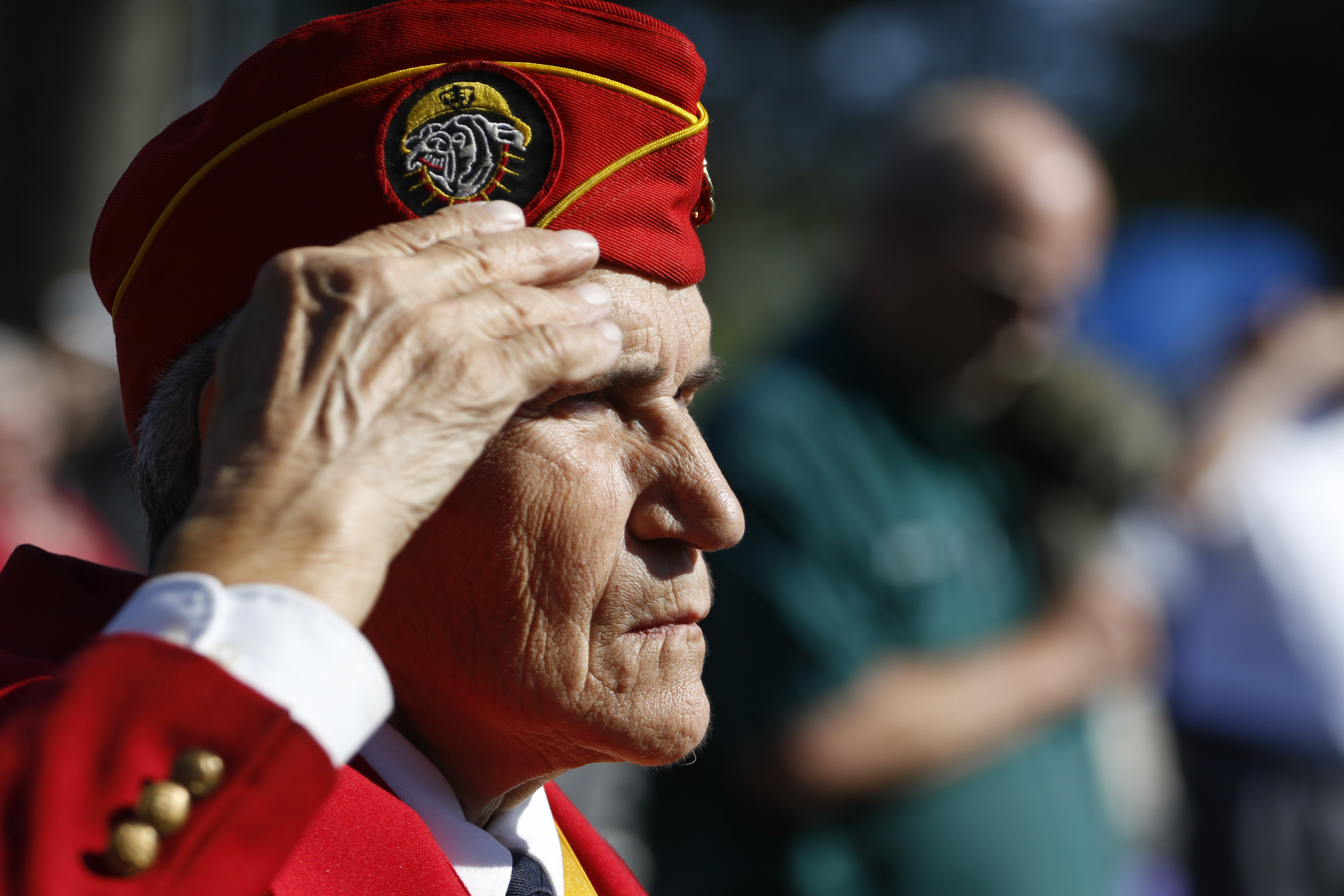 Staff Photo by Dan Henry / The Chattanooga Times Free Press- 11/11/15. Marilyn A. Nagel salutes as the national anthem is played for patriots, veterans and officials during a special Veteranճ Day tribute on November, 11, 2015 at the Chattanooga National Cemetery Armed Forces Pavillon. The Chattanooga National Cemetery and the Chattanooga Area Veterans Council hosted the event.