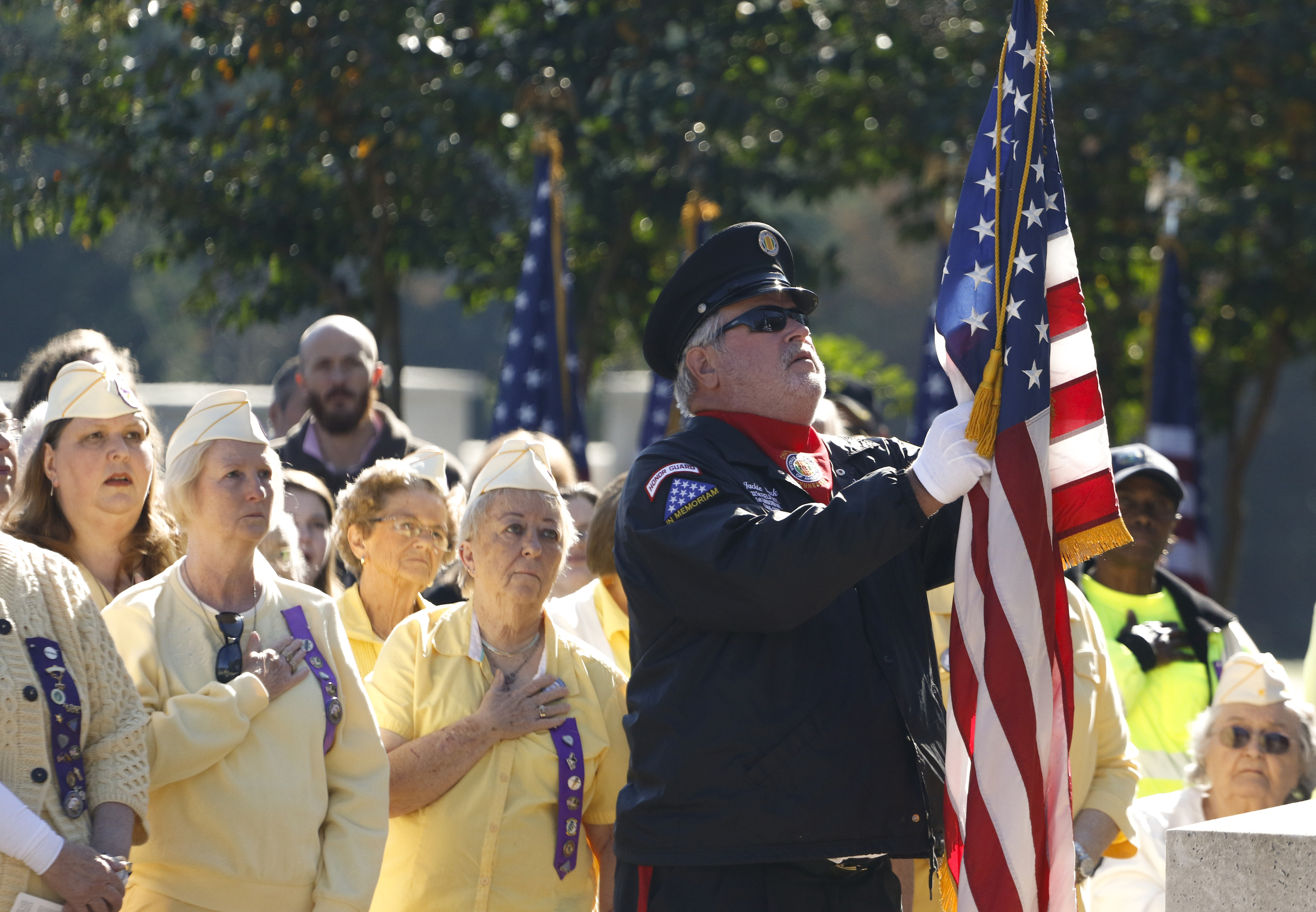 Staff Photo by Dan Henry / The Chattanooga Times Free Press- 11/11/15. Jackie Clark posts the colors during a special Veteranճ Day tribute on November, 11, 2015 at the Chattanooga National Cemetery Armed Forces Pavillon. The Chattanooga National Cemetery and the Chattanooga Area Veterans Council hosted the event.