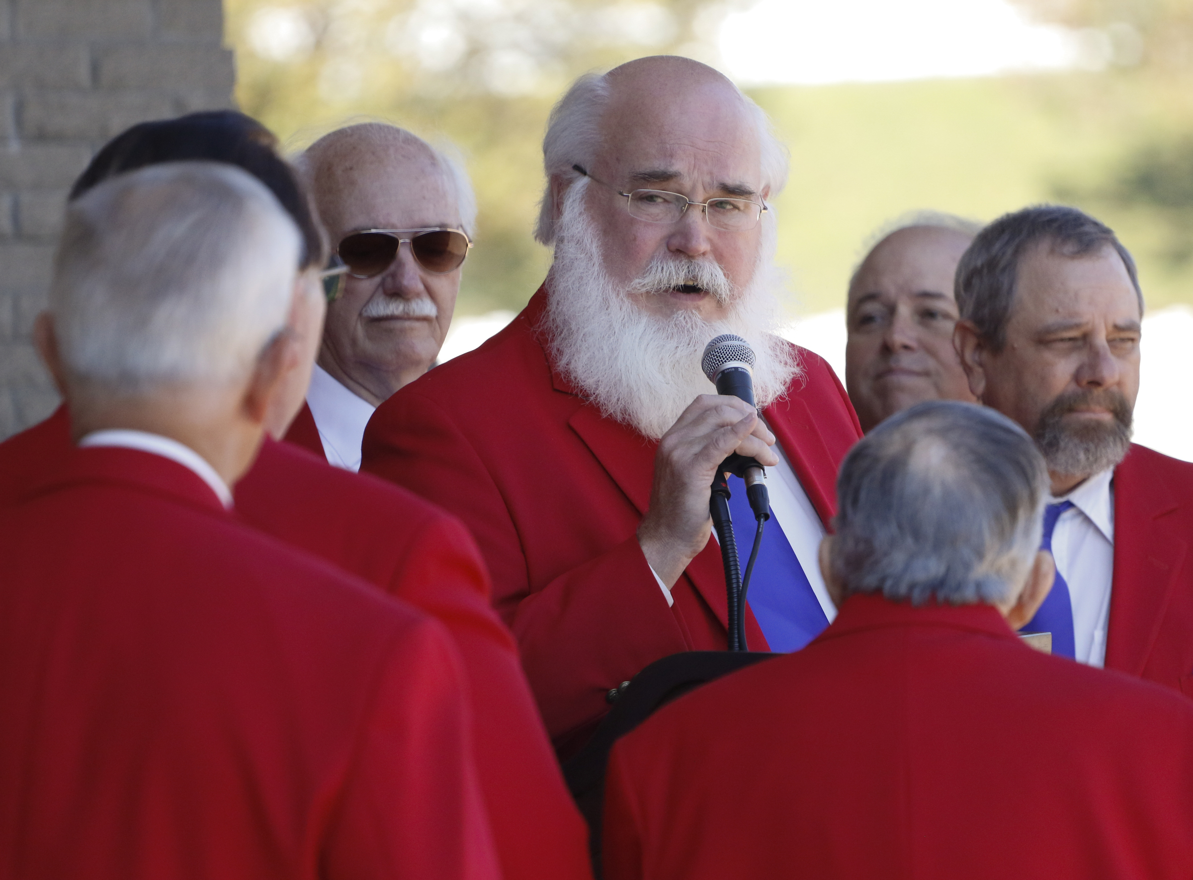 Staff Photo by Dan Henry / The Chattanooga Times Free Press- 11/11/15. Chorus director Paul Blazek leads members of the Choo Choo Chorus in song during a special Veteranճ Day tribute on November, 11, 2015 at the Chattanooga National Cemetery Armed Forces Pavillon. The Chattanooga National Cemetery and the Chattanooga Area Veterans Council hosted the event.