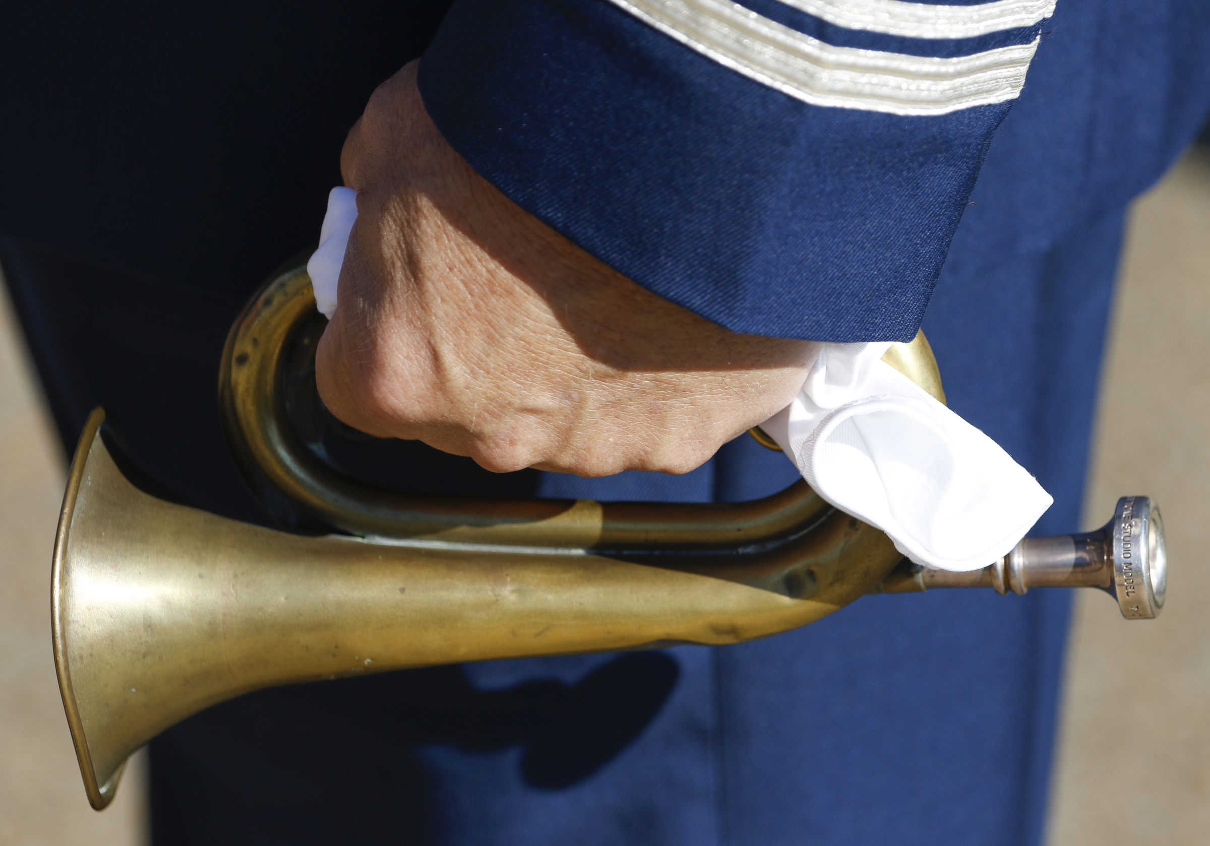 Staff Photo by Dan Henry / The Chattanooga Times Free Press- 11/11/15. David Cox prepares to play Taps on his bugle for patriots, veterans and officials during a special Veteranճ Day tribute on November, 11, 2015 at the Chattanooga National Cemetery Armed Forces Pavillon. The Chattanooga National Cemetery and the Chattanooga Area Veterans Council hosted the event.