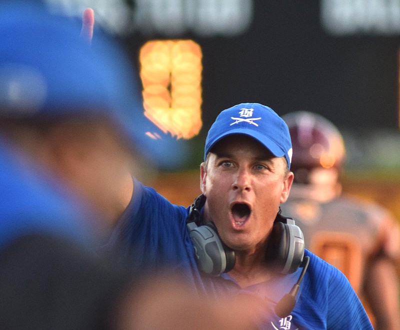 Boyd-Buchanan football coach Grant Reynolds calls for the kicking team and a PAT after the Buccaneers scored a touchdown during their Sept. 18 game at Tyner. The Bucs won 40-7, and they host a rematch with the Rams tonight in the second round of the Class 2A state playoffs.