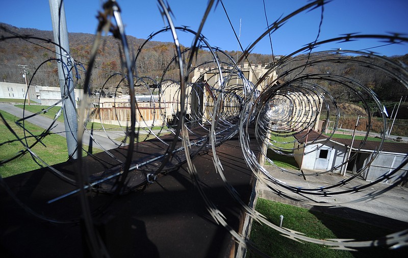 Razor wire loops over the outer wall of Brushy Mountain State Penitentiary in Petros on Wednesday, Nov. 11, 2015.