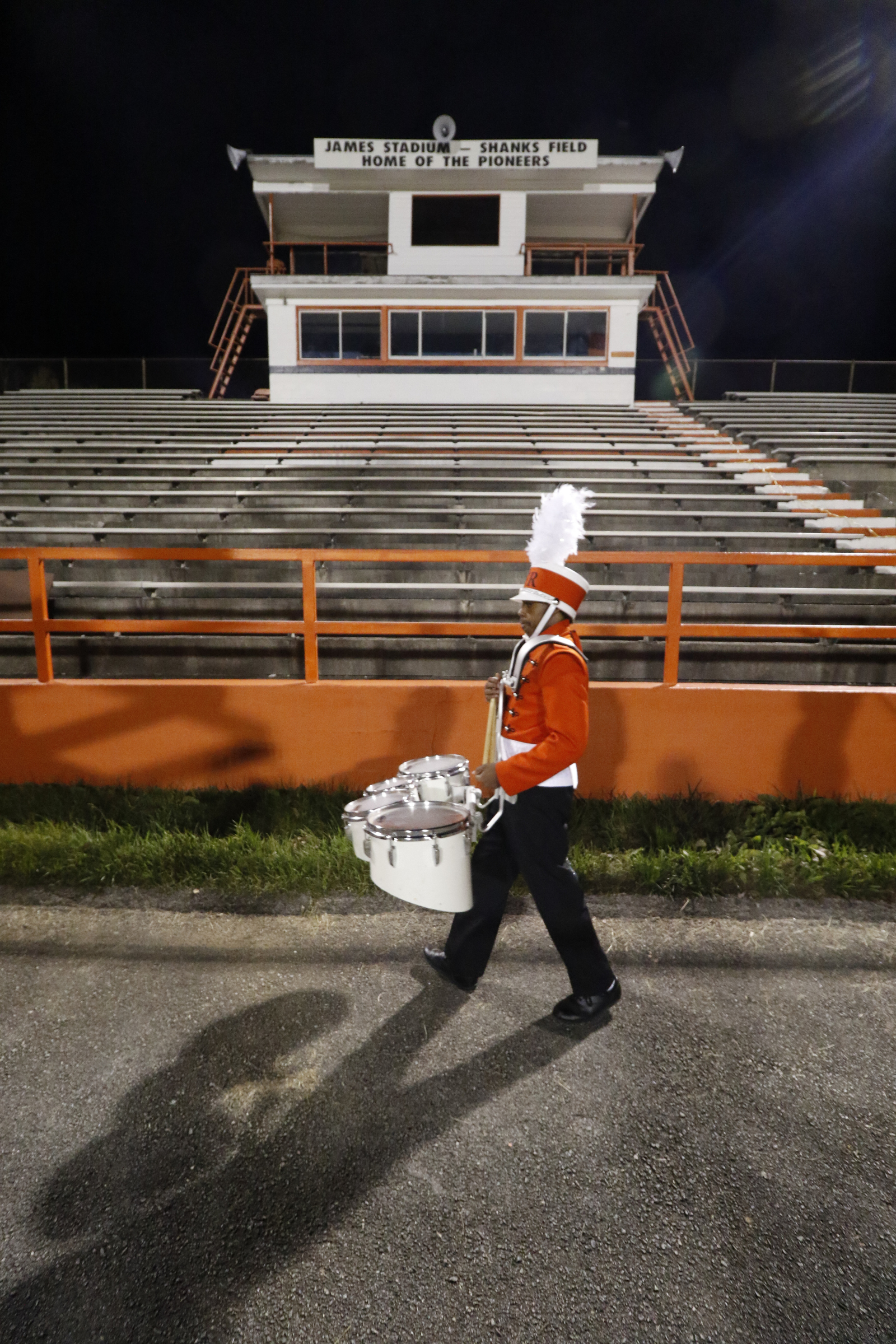 *Staff Photo by Dan Henry / The Chattanooga Times Free Press- 11/13/15. East Ridge sophomore Chris McConnell marches past the condemned Pioneers stadium before his team plays Chattanooga Christian on Friday, November 13, 2015.