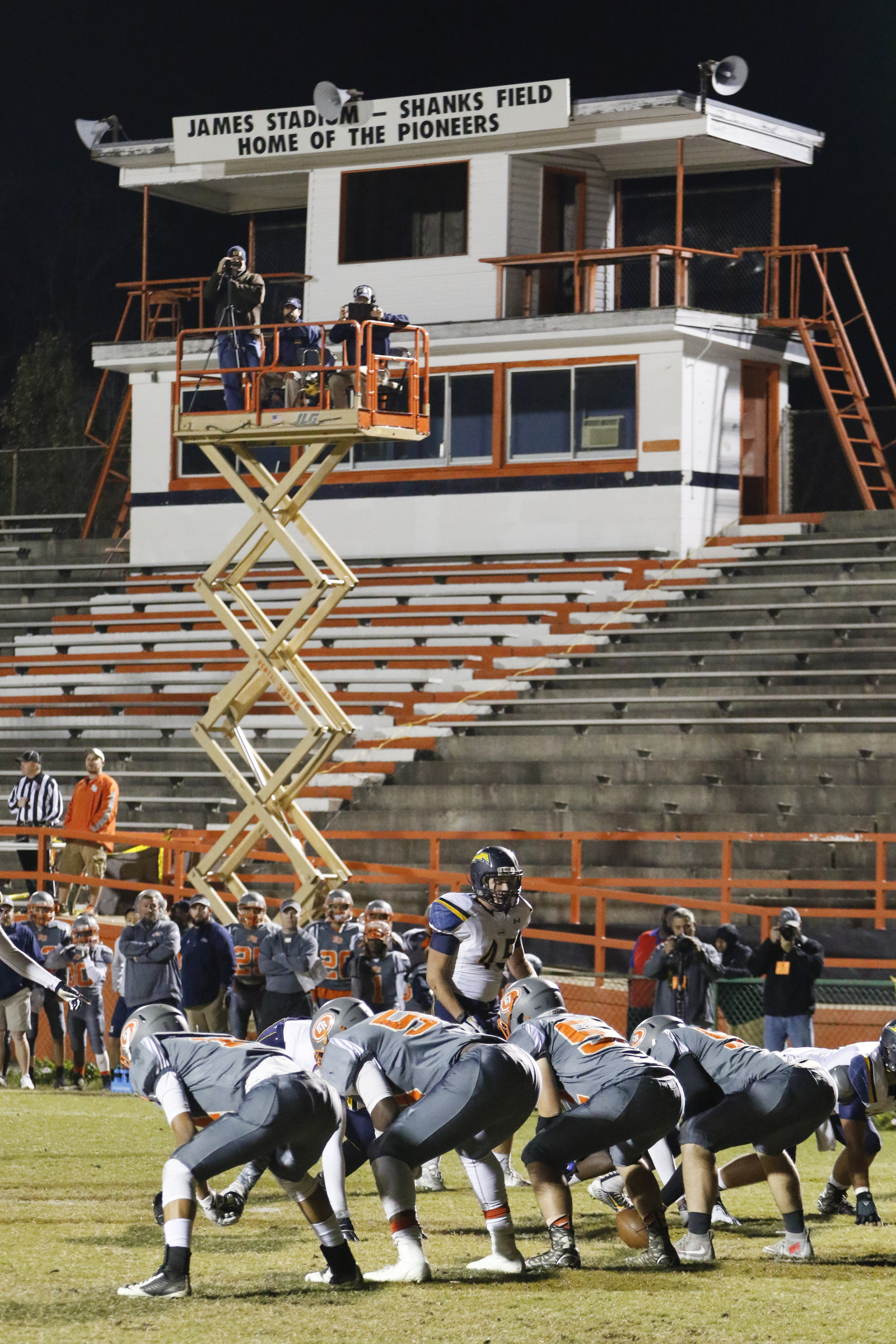 *Staff Photo by Dan Henry / The Chattanooga Times Free Press- 11/13/15. The game announcer uses a lift truck to call the game as East Ridge plays Chattanooga Christian on Friday, November 13, 2015 after the Pioneer's home stadium was condemned.