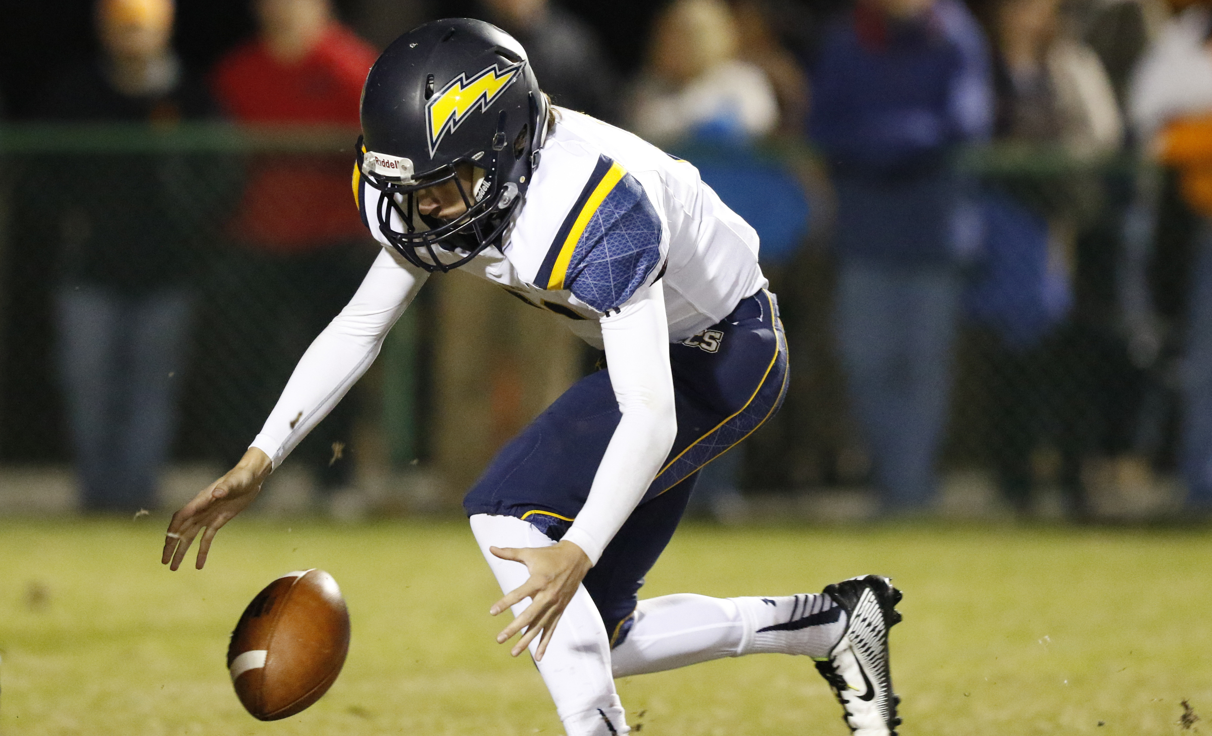 *Staff Photo by Dan Henry / The Chattanooga Times Free Press- 11/13/15. Chattanooga Christian quarterback Matthew Mercer (11) recovers a bad snap before looking to get rid of the ball while playing East Ridge at the Pioneer's home field on Friday, November 13, 2015.