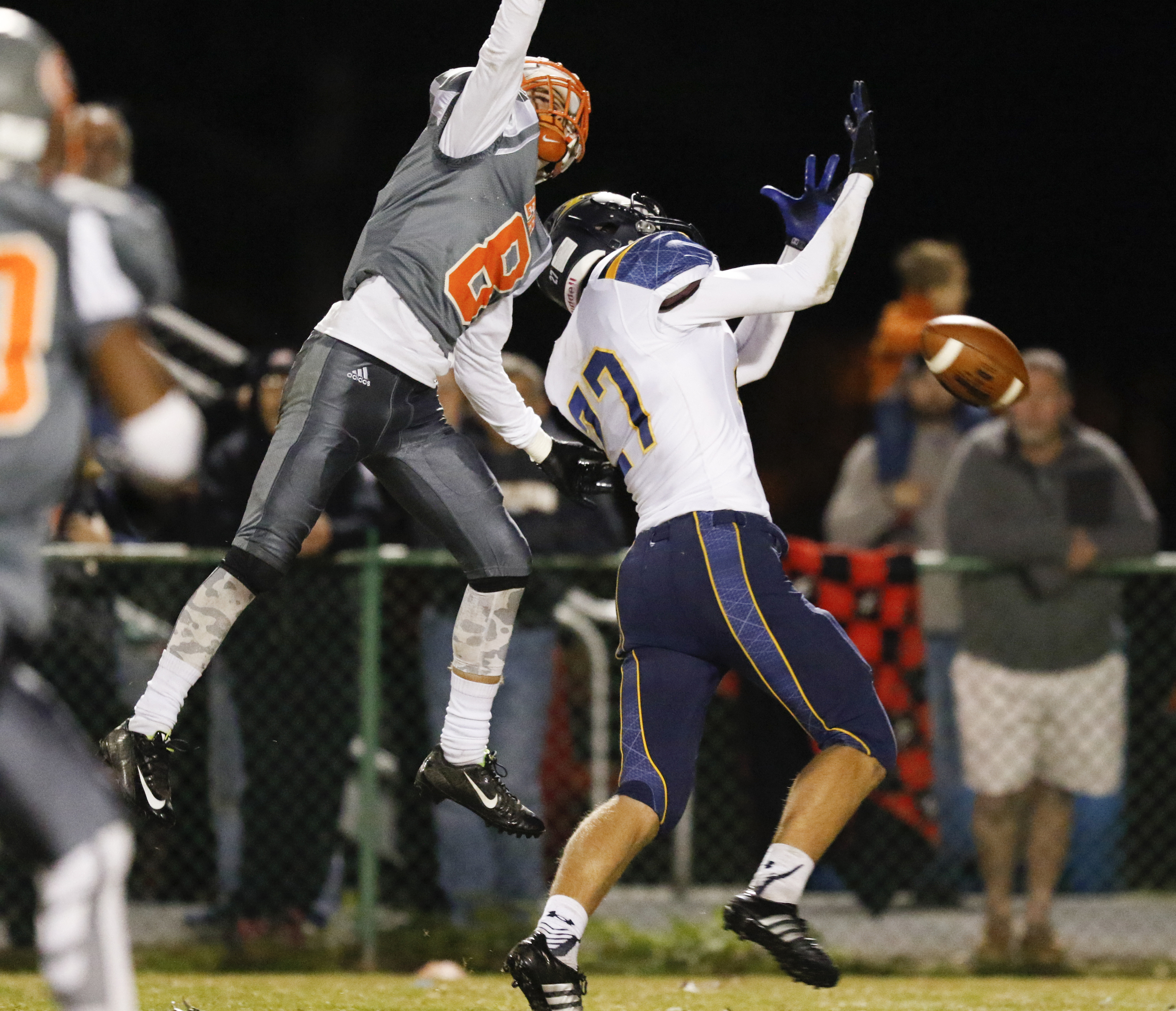 *Staff Photo by Dan Henry / The Chattanooga Times Free Press- 11/13/15. East Ridge's Josh Williams (8) breaks up a pass intended for Chattanooga Christian's Will Patton (27) at the Pioneer's home field on Friday, November 13, 2015.