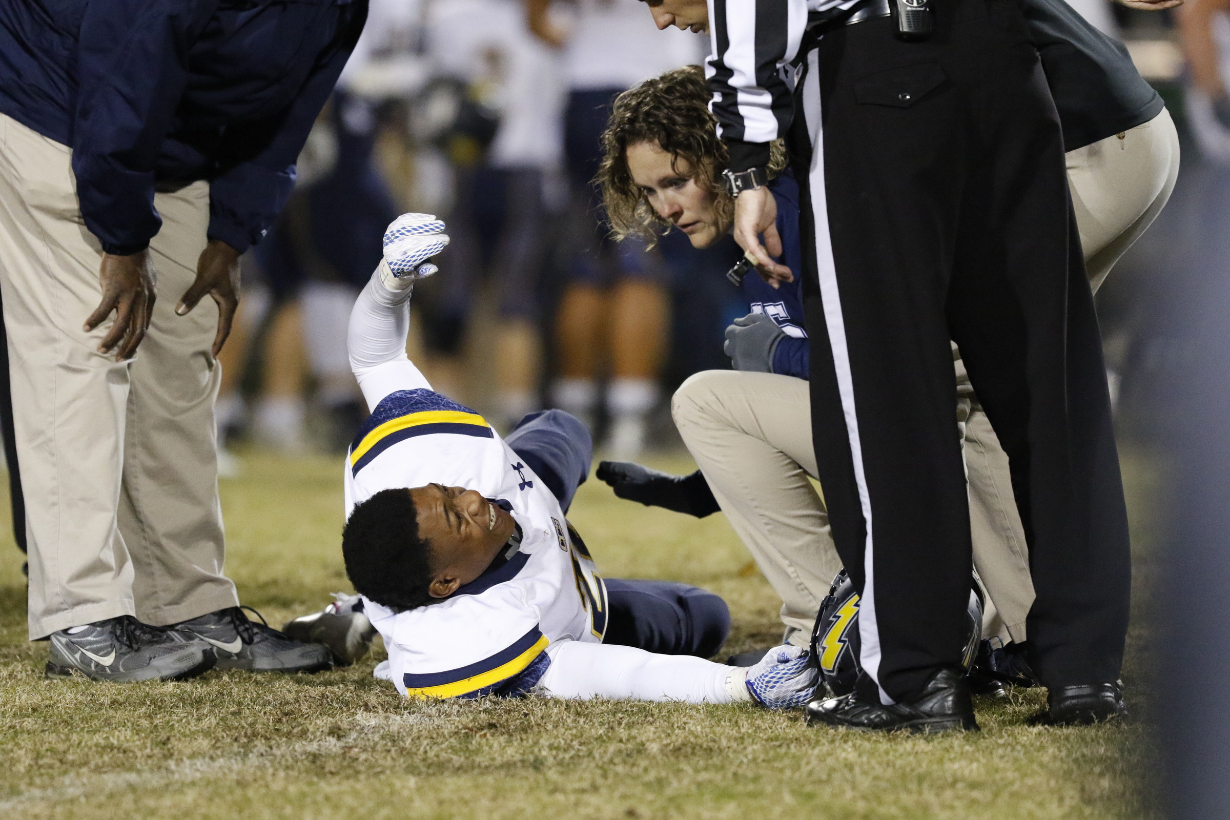 *Staff Photo by Dan Henry / The Chattanooga Times Free Press- 11/13/15. Chattanooga Christian's T.J. Smith (22) is injured while playing East Ridge at the Pioneer's home field on Friday, November 13, 2015.