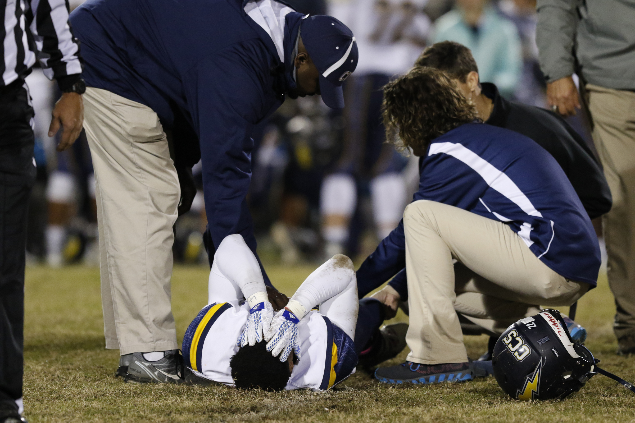 *Staff Photo by Dan Henry / The Chattanooga Times Free Press- 11/13/15. Chattanooga Christian's T.J. Smith (22) is injured while playing East Ridge at the Pioneer's home field on Friday, November 13, 2015.