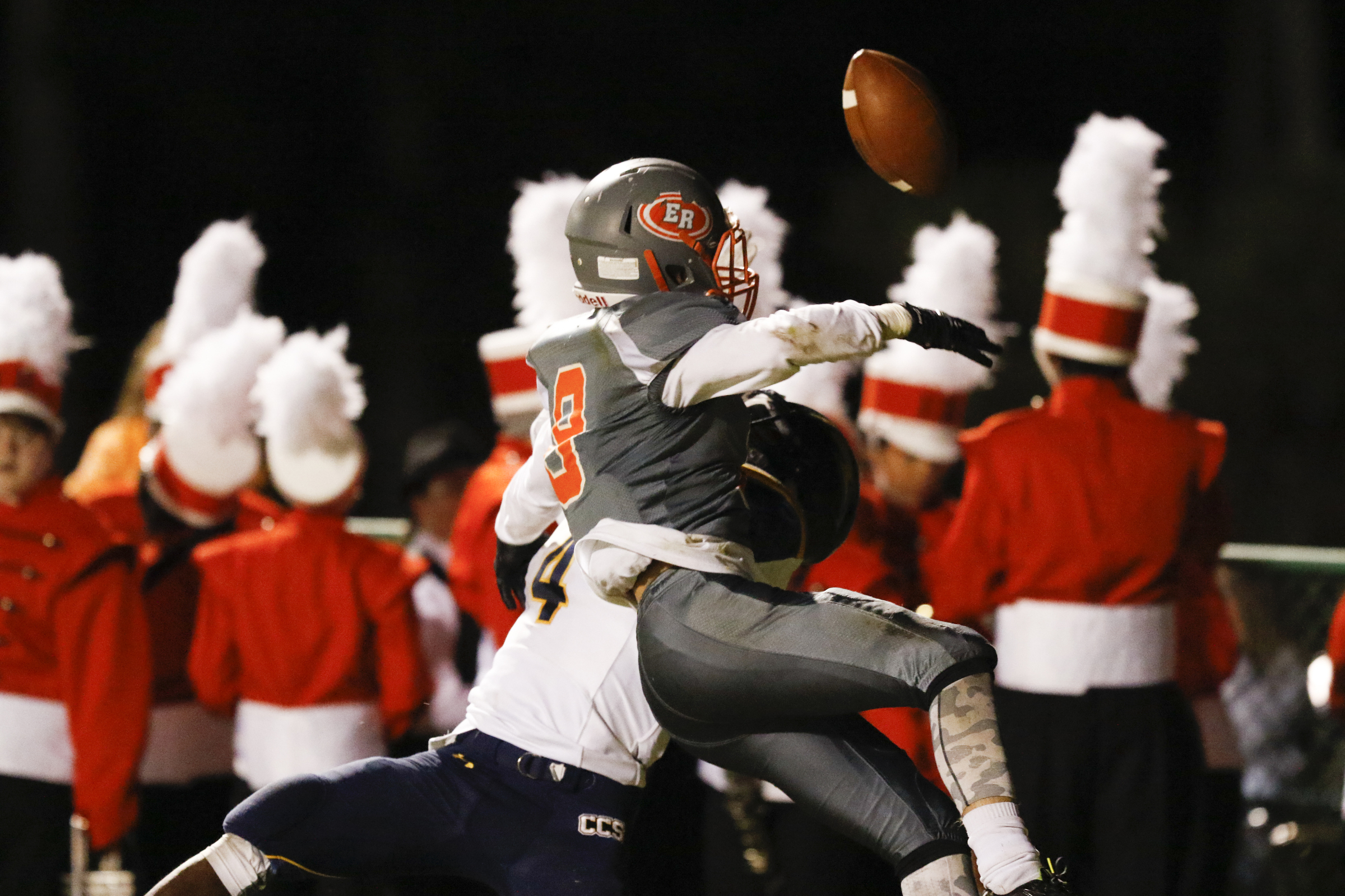 *Staff Photo by Dan Henry / The Chattanooga Times Free Press- 11/13/15. East Ridge's Josh Williams (8) and Chattanooga Christian's Brandon Mason (4) collide at the Pioneer's home field on Friday, November 13, 2015.
