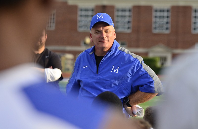 McCallie Head Coach Ralph Potter talks to his team after a scrimmage game against Sevier County at McCallie High School in Chattanooga, Tenn. on July 31, 2014.