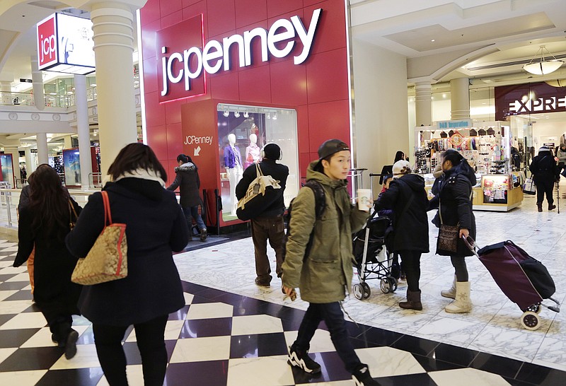 
              FILE - In this Feb. 19, 2015, file photo, shoppers visit a J.C. Penney store in New York. The Texas-based retailer reports quarterly financial results, Friday, Nov. 13, 2015. (AP Photo/Mark Lennihan, File)
            