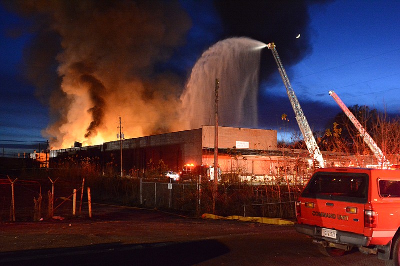 The former Barwick Mills building burns on Saturday, Nov. 14, 2015, in LaFayette, Ga.