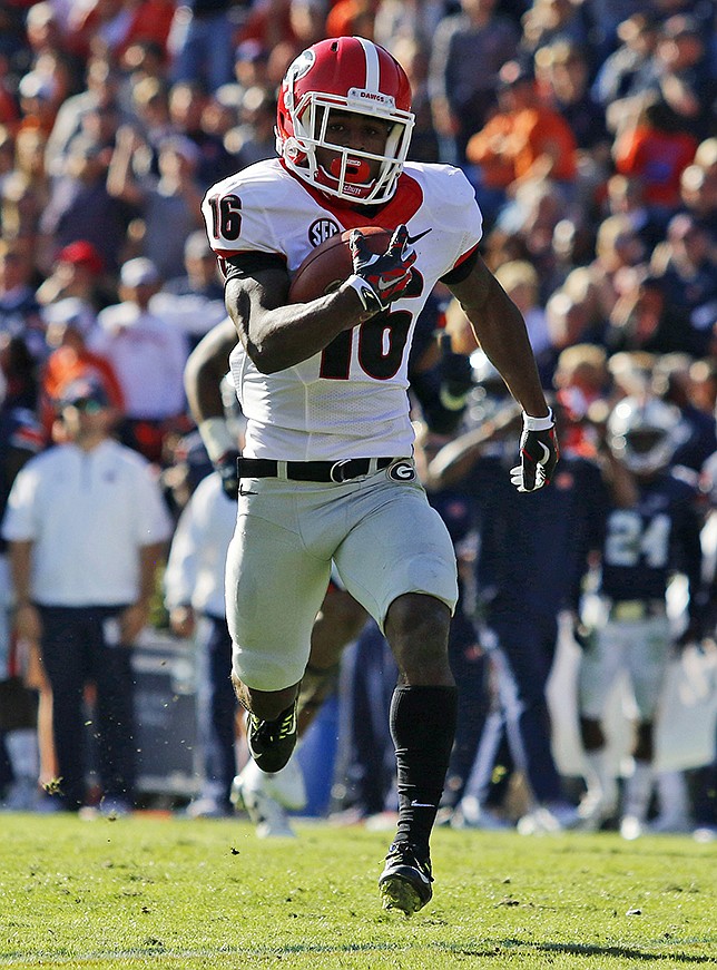 Georgia's Isaiah McKenzie returns a punt for a touchdown against Auburn during the second half of an NCAA college football game on Saturday, Nov. 14, 2015 in Auburn, Ala. Georgia won 20-13. (Todd J. Van Emst/Opelika-Auburn News via AP) MANDATORY CREDIT