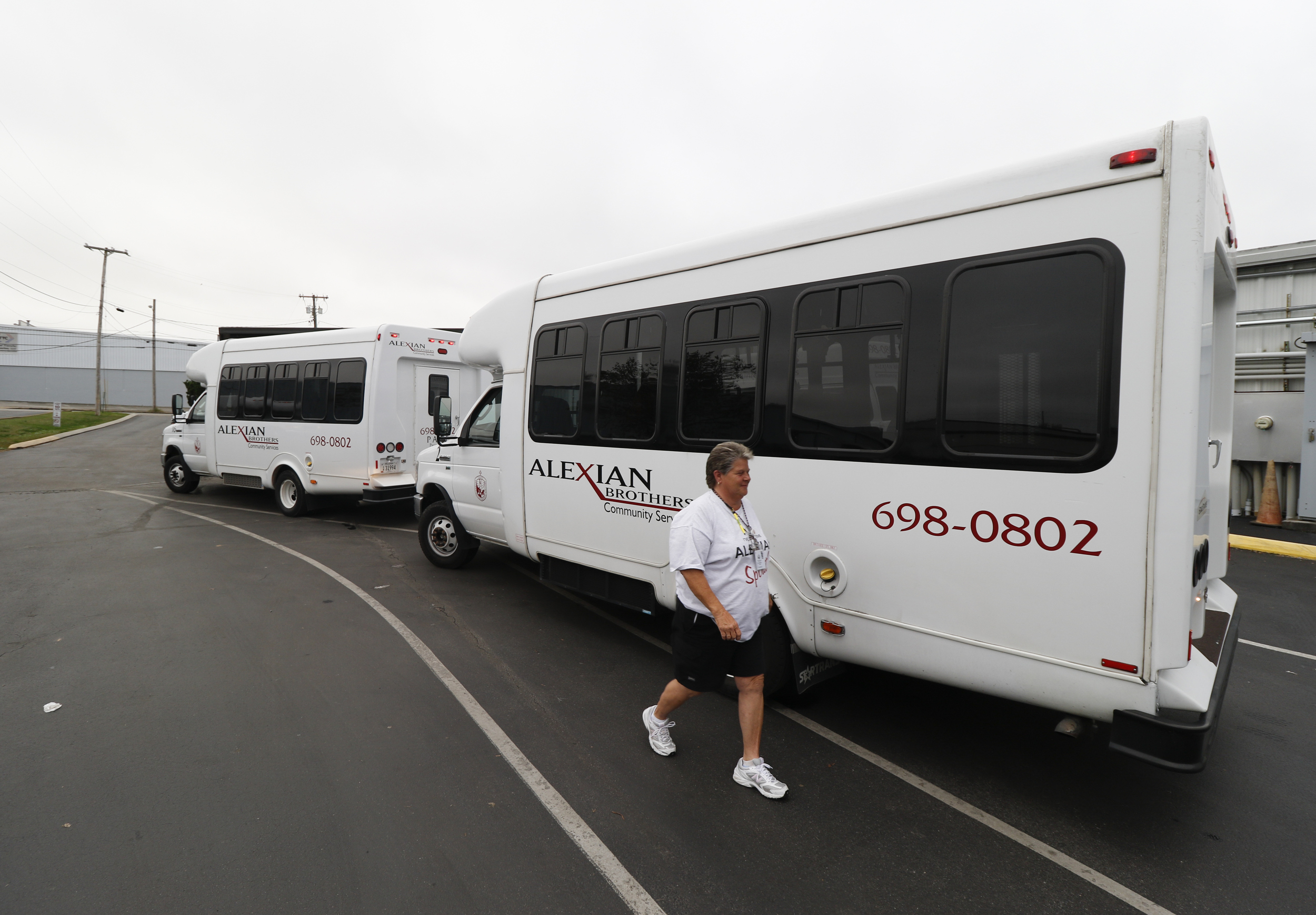 Staff Photo by Dan Henry / The Chattanooga Times Free Press- 11/5/15. Vicki England returns to her bus after unloading a few adult daycare clients at the Alexian Brothers Community Services facility off of Cumberland Street in downtown Chattanooga on Wednesday, November 4, 2015.