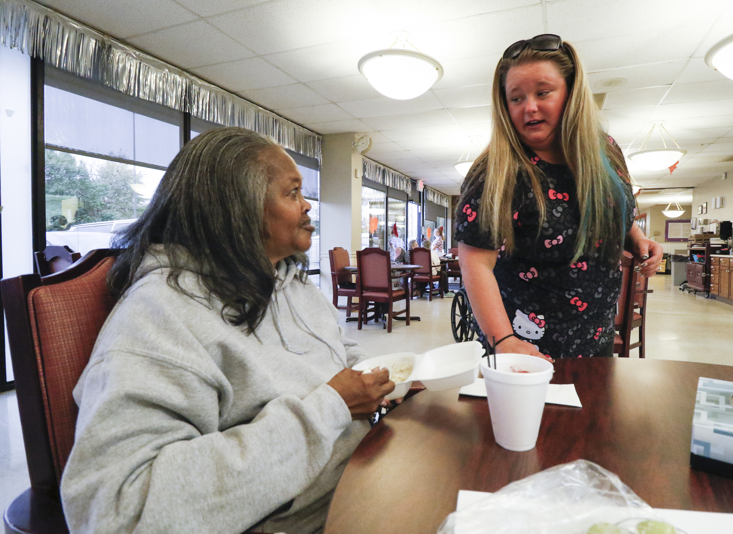 Staff Photo by Dan Henry / The Chattanooga Times Free Press- 11/5/15. CNA Ashley Lingelbach speaks to her adult daycare client Martha Sims while at the Alexian Brothers Community Services facility off of Cumberland Street in downtown Chattanooga on Wednesday, November 4, 2015.