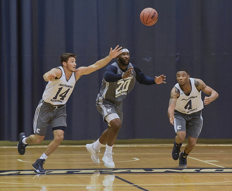 From left, Alex Bran, Duke Ethridge and Johnathan Burroughs-Cook chase a loose ball during a UTC intrasquad scrimmage in the preseason. Burroughs-Cook had 23 points Friday night as he made his Mocs debut in a road win against Georgia.