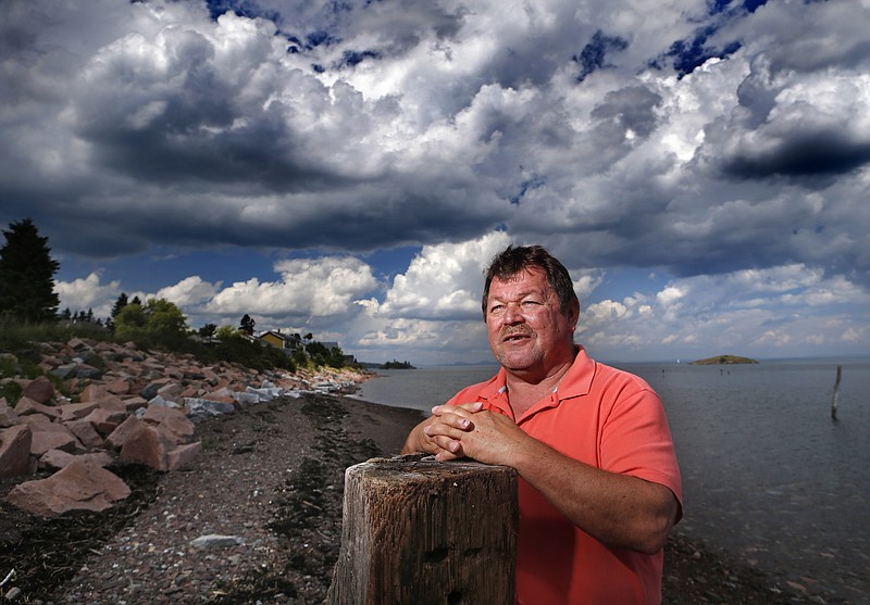 
              In this July 31, 2015, photo, Passamaquoddy tribal Chief Frederick J. Moore poses on the waterfront at Pleasant Point, Maine. A century after the state outlawed the salmon spear fishing that fed their ancestors, Native American tribes who trace their history back millennia say their trust in the government of Maine is at an all-time low. (AP Photo/Robert F. Bukaty)
            